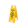 A small yellow caution sign, warning of a wet floor.